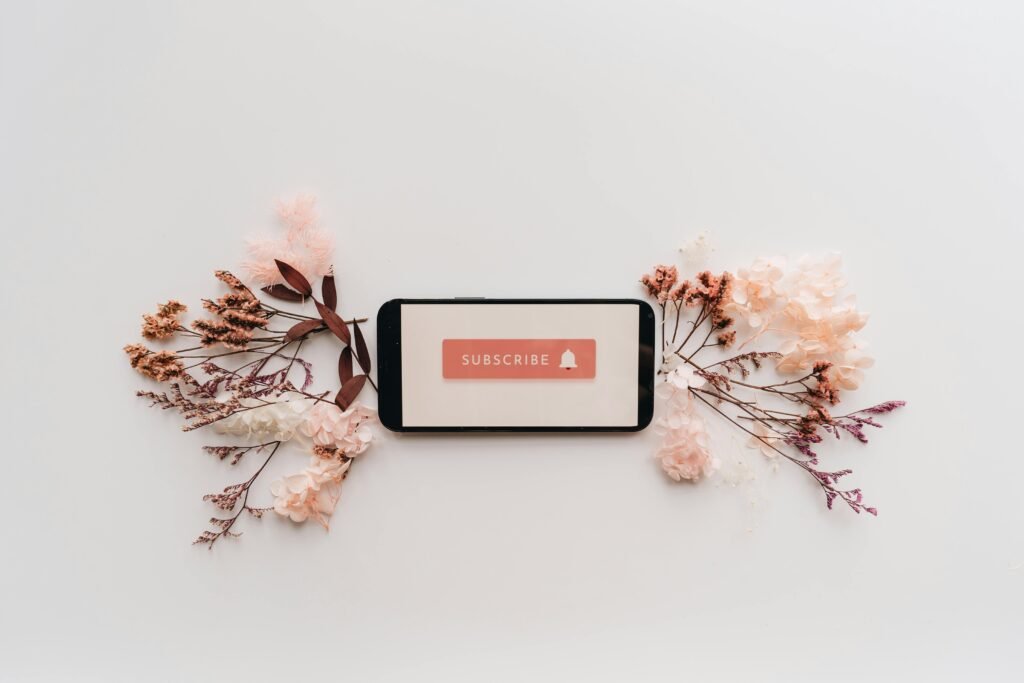 Flat Lay of Dried Flowers and Mobile Phone